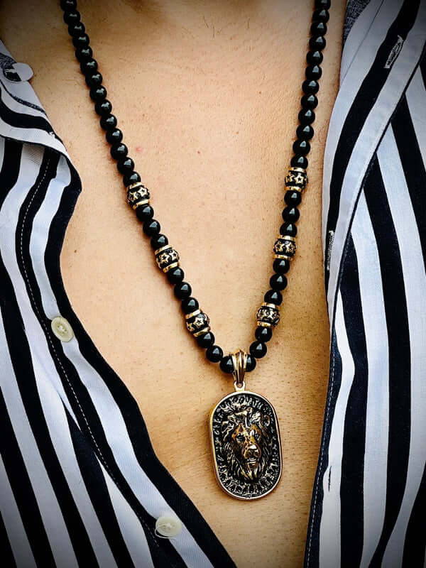 THE MEN THING SS Pendant with Chain WARRIOR NECKWEAR - Pure Titanium Steel Lion Head Shield 18K Pvd Gold Plated Necklace with 8mm Black Onyx Beads 27inch Chain for Men & Boys
